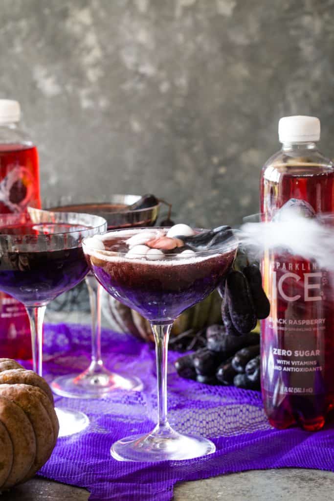 halloween vodka cocktails with sparkling ice in back