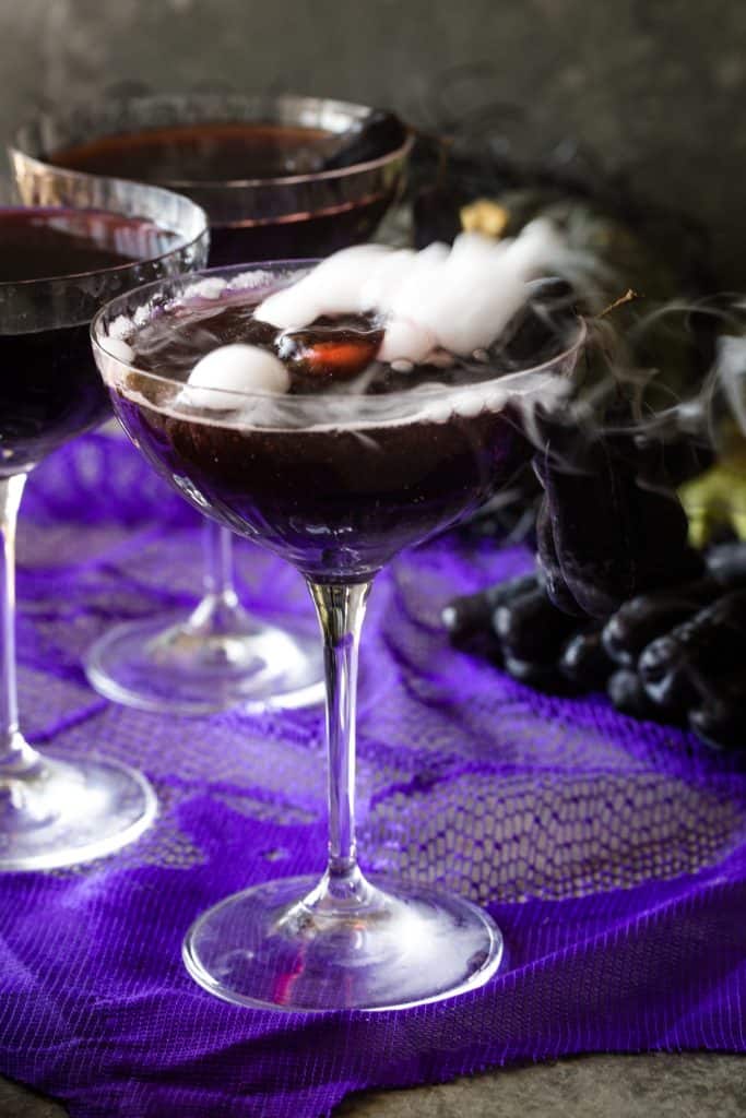 up close of halloween vodka cocktail with purple background