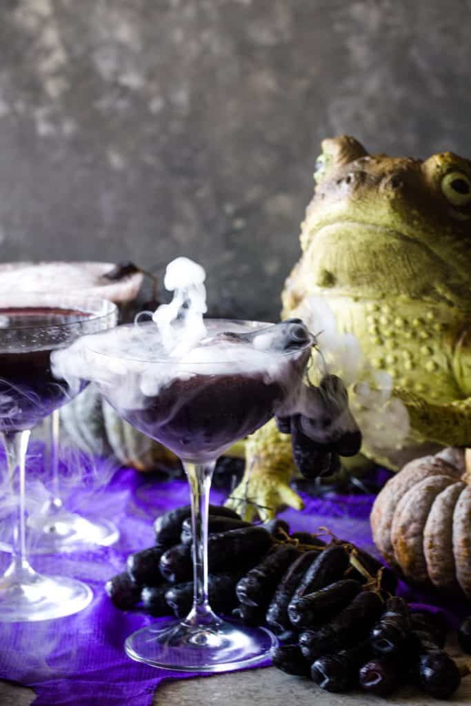 smoking cocktail with frog in background