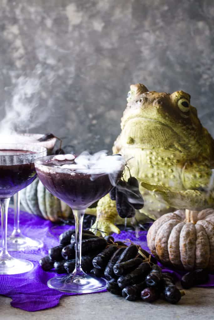 smoking cocktails on grey background with frog in background