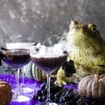 shot with smoking cocktails with frogs and pumpkins in background