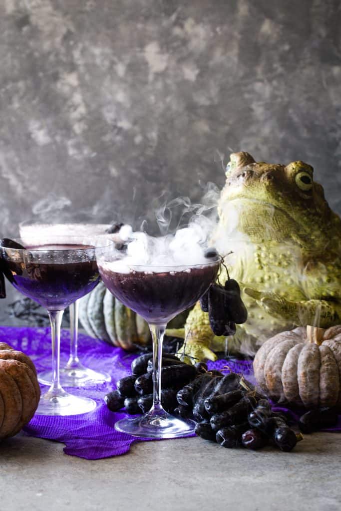 shot with smoking cocktails with frogs and pumpkins in background