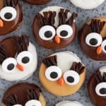 overhead shot of chocolate and peanut butter owls on round metal plate
