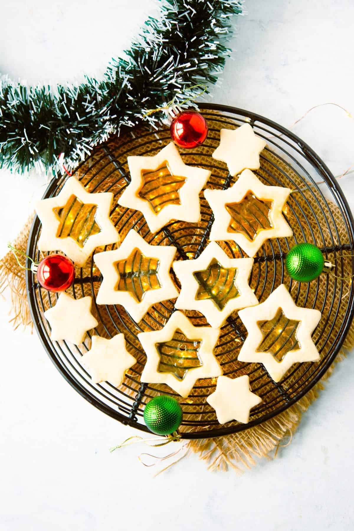stained glass sugar cookies on round wire cooling rack