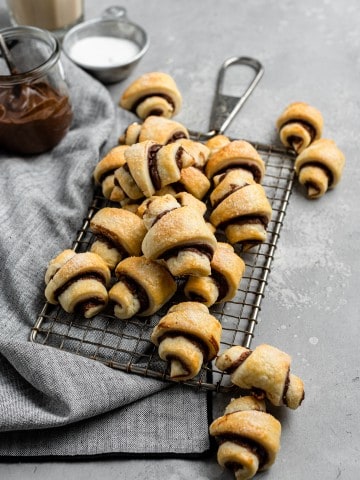 a pile of the best rugelach cookies on a small vintage metal cooling rack