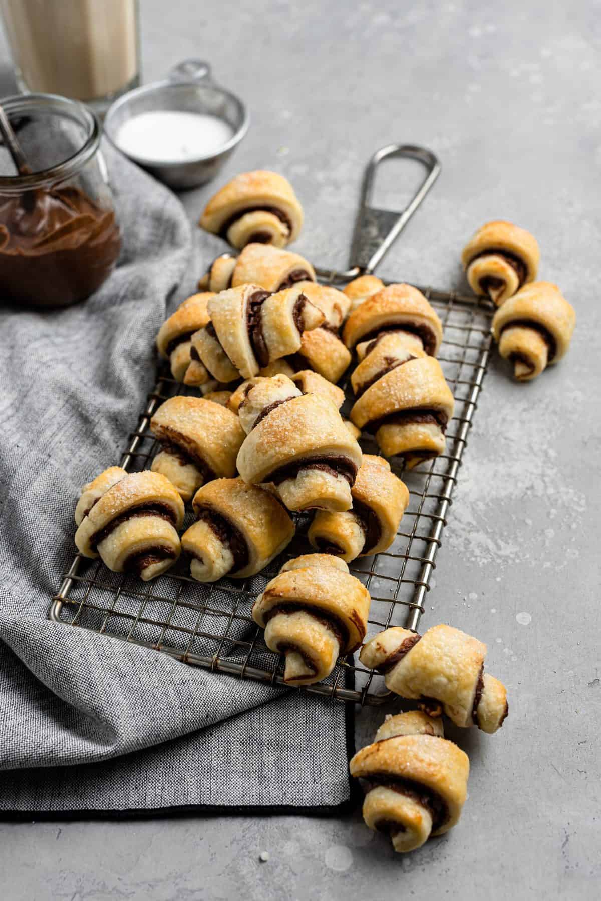 a pile of the best rugelach cookies on a small vintage metal cooling rack