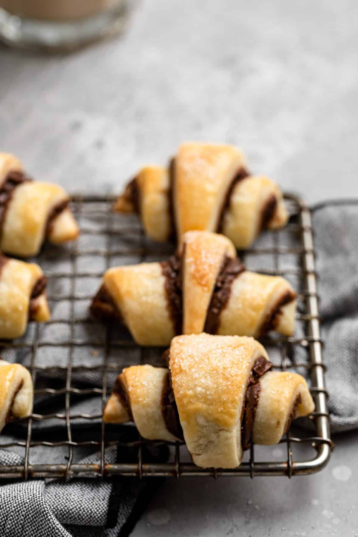 up close photo of Nutella filled rugelach cookies on wire cooling rack