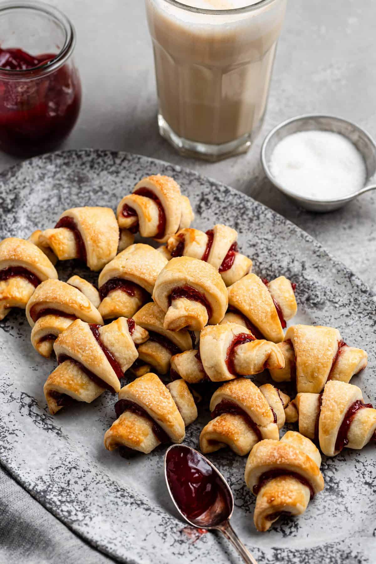 a metal dish with a pile of strawberry and Nutella filled rugelach cookies