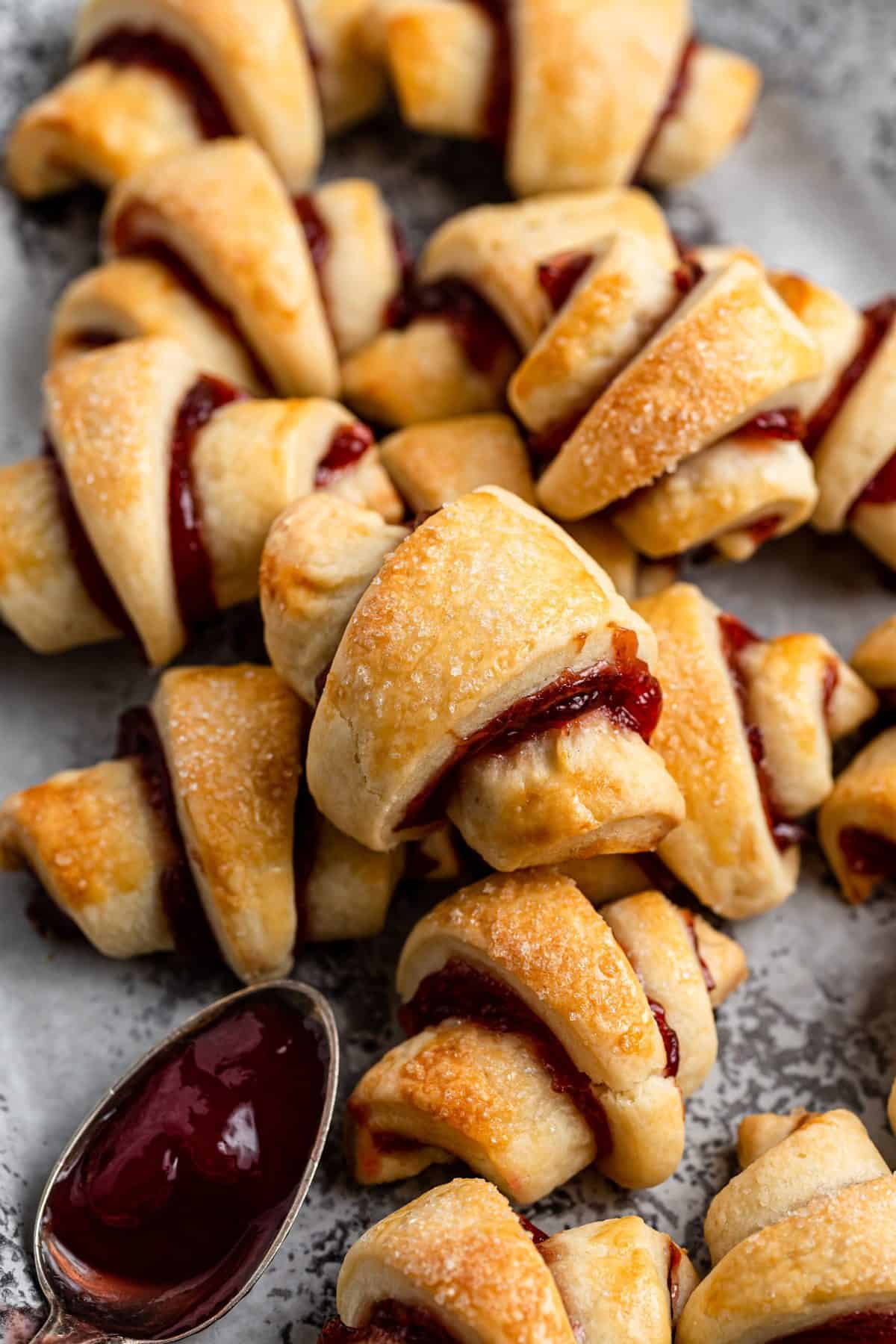 strawberry filled rugelach cookies on metal tray