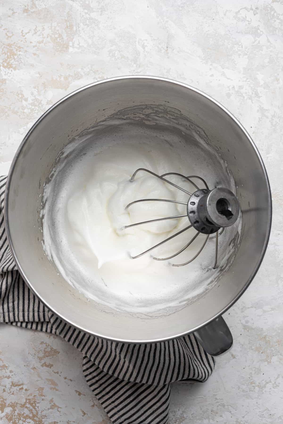 beating egg whites in metal bowl
