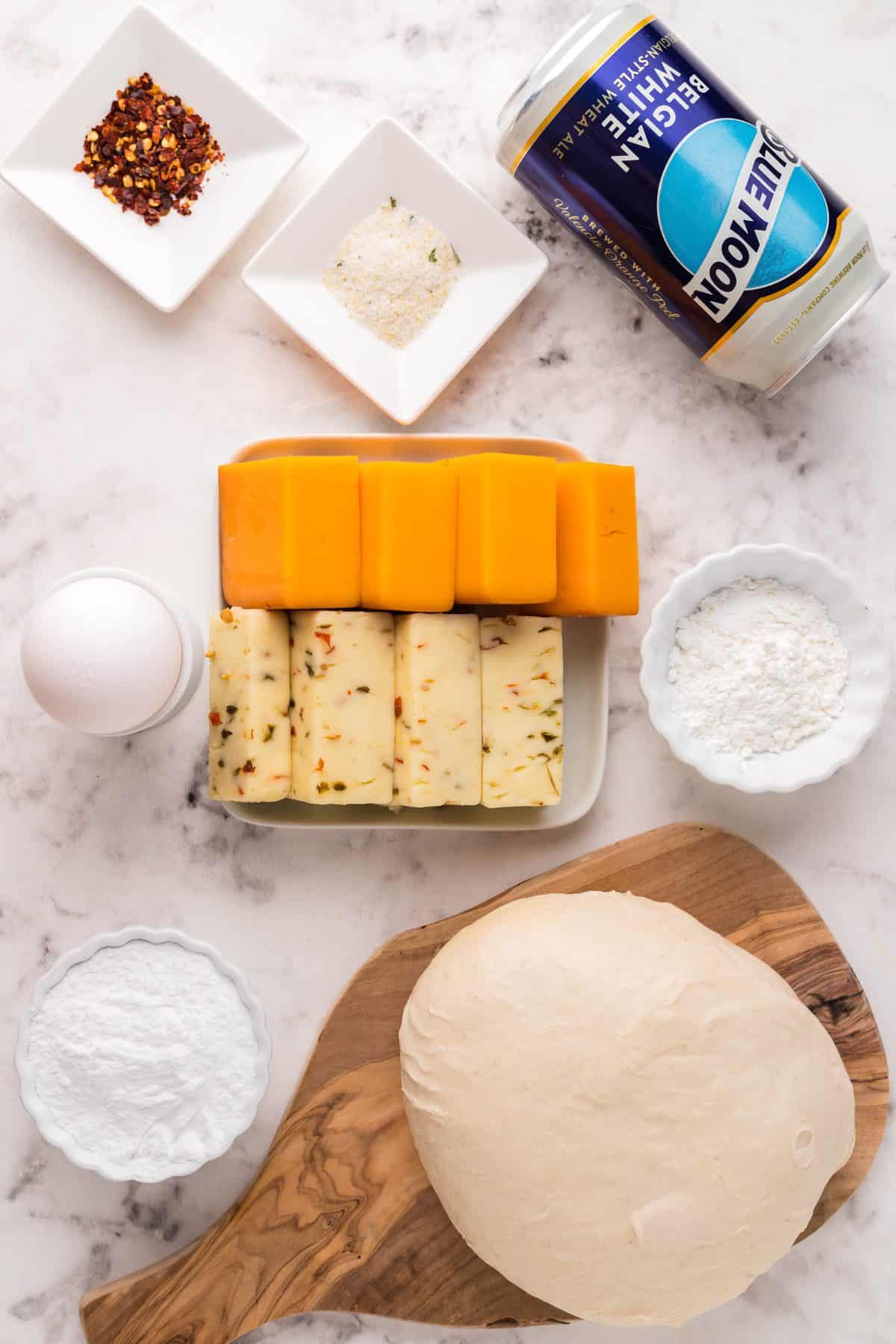 ingredients laid out to make beer cheese stuffed pretzel rolls