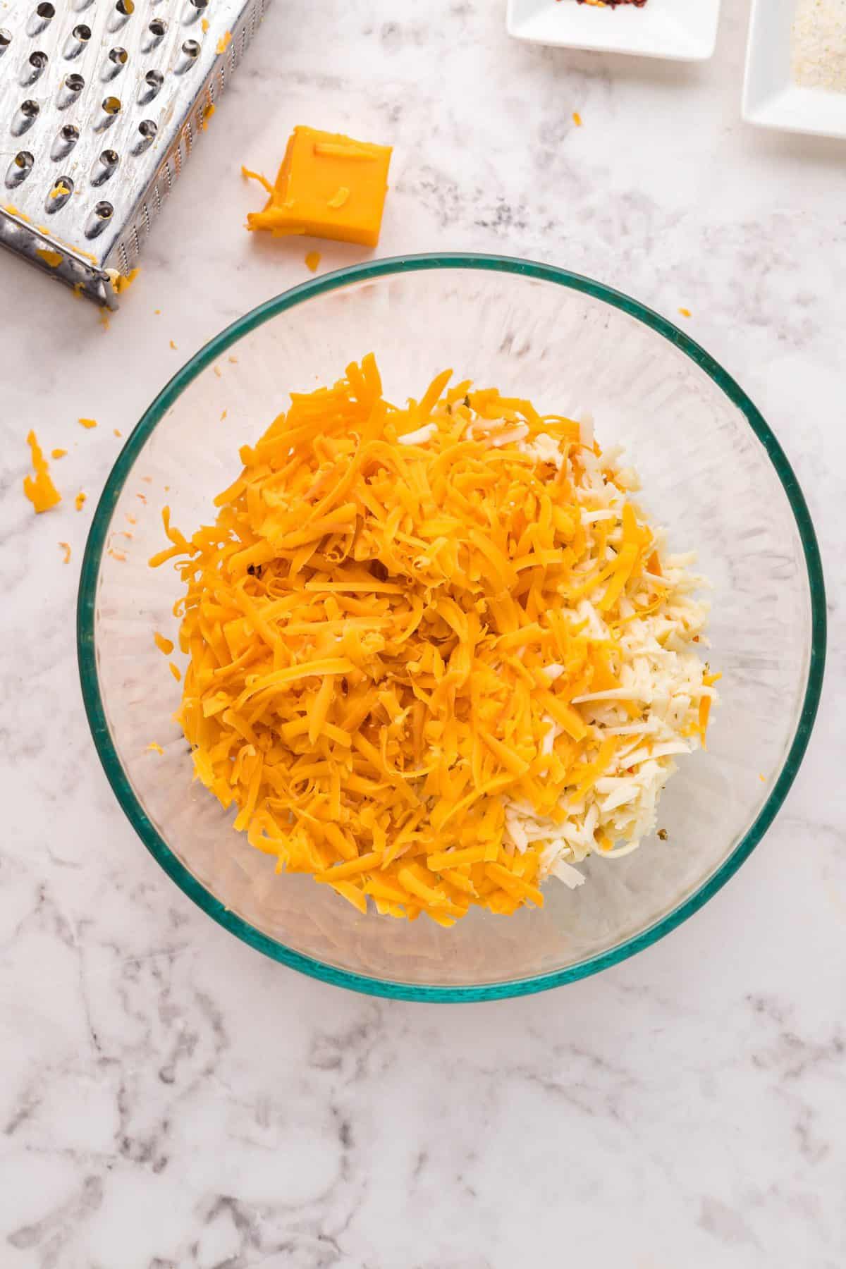 grated cheese into a large glass bowl