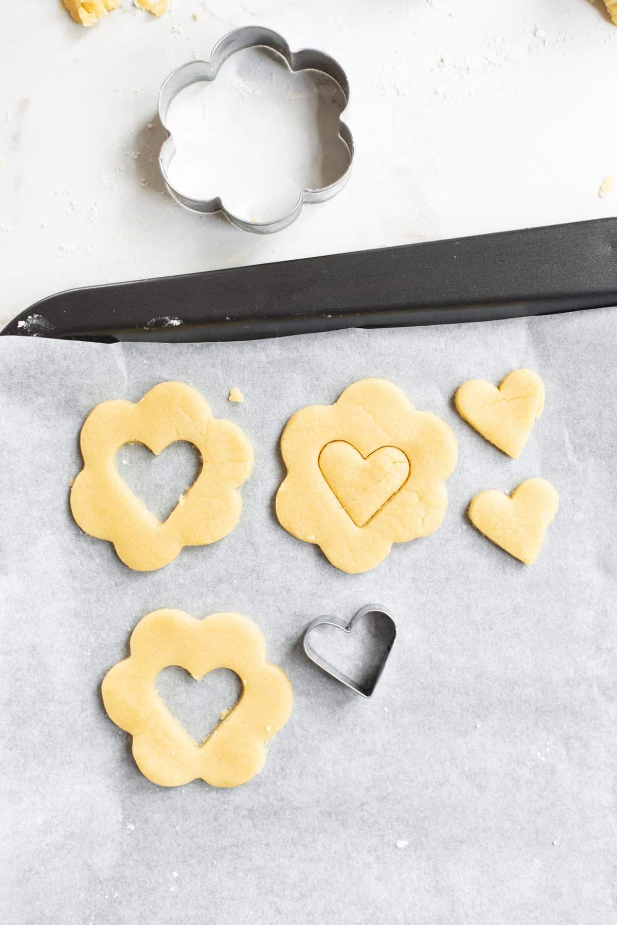 small heart cookie cutter cutting out the center of the flowers