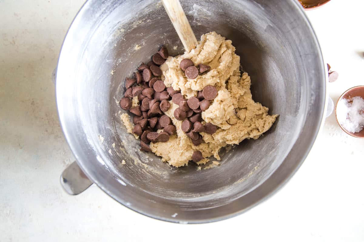 stirring in the chocolate chips to the cookie batter. 