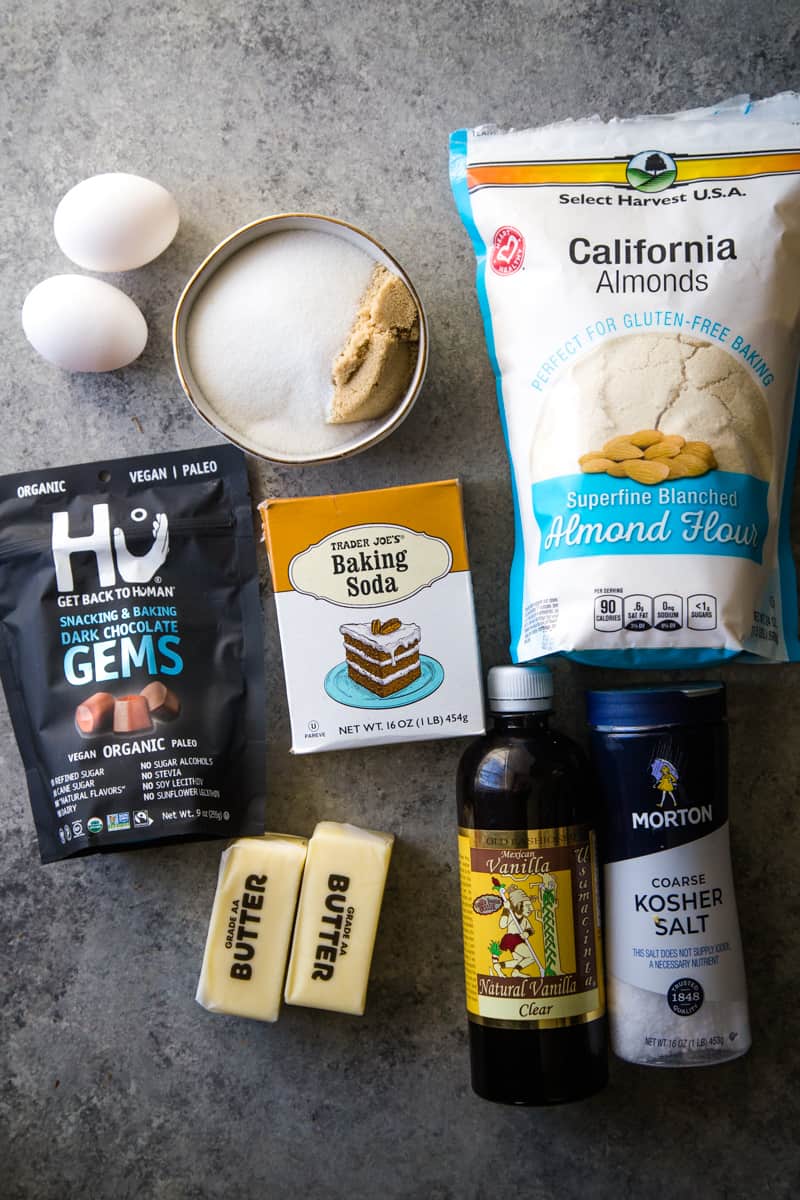 ingredients laid out on a metal background to make almond flour cookies. 
