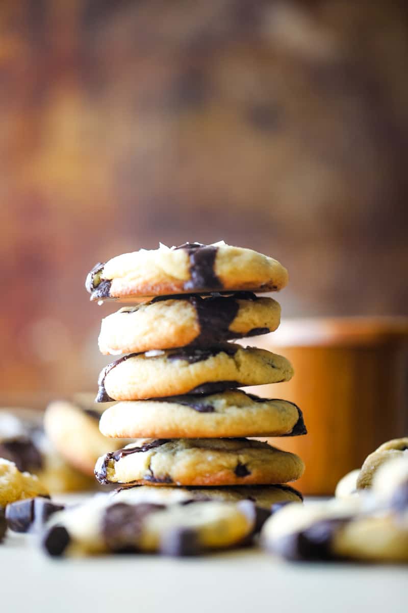 A stack of almond flour chocolate chip cookies with metal background. 
