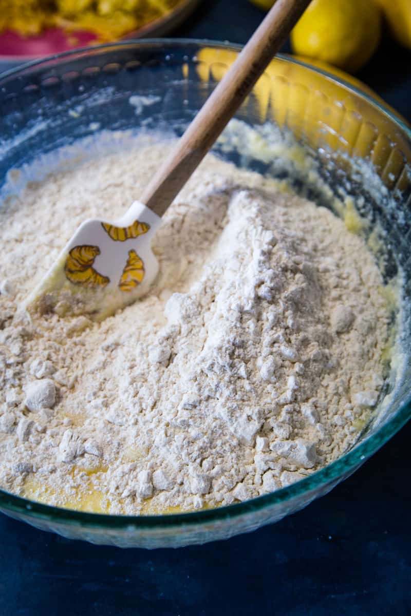 Adding the flour to the Bundt Cake batter. 