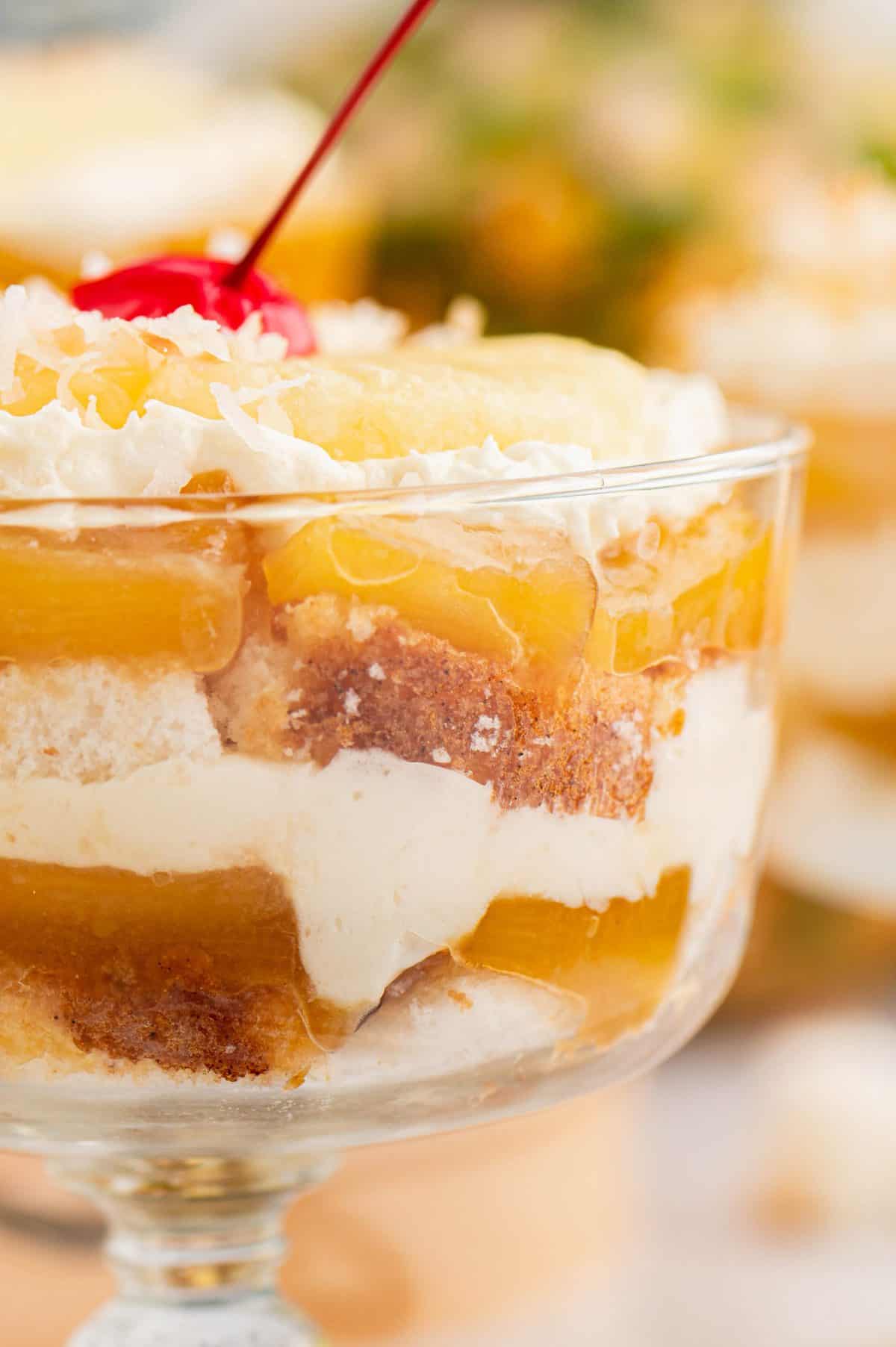 Up close photo of the layers of the pineapple upside down cheesecake trifle. 