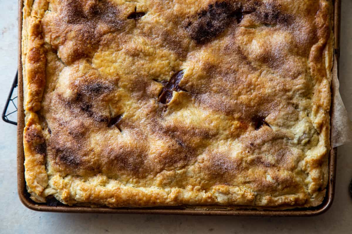 Up close photo of the crust of the apple slab pie. 