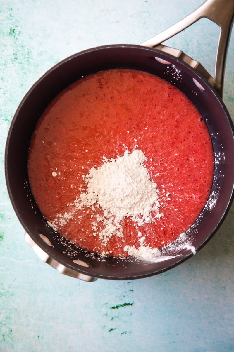 Strawberry puree with cornstarch added in pan. 