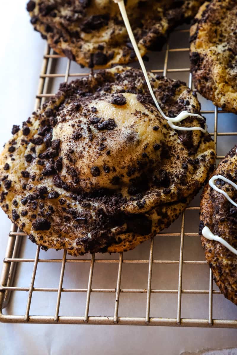 Drizzle the vanilla glaze over the cookie on wire rack. 