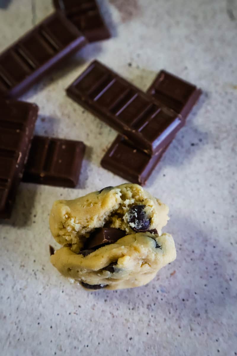 Cookie dough sandwiched with a piece of chocolate. 