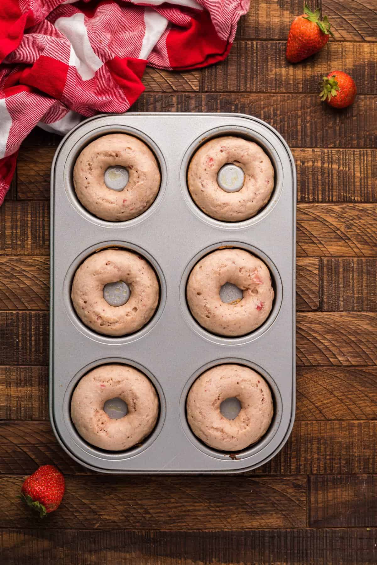 overhead shot of the baked donuts in metal donut pan.