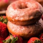 donut stacked with fresh strawberries square image.