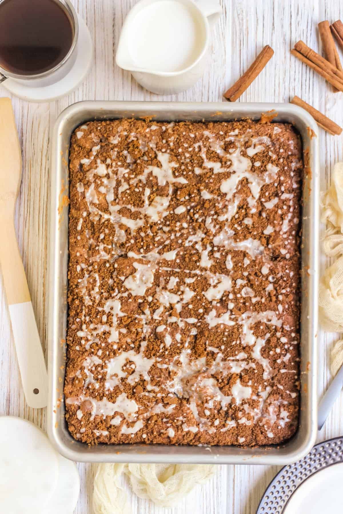 Overhead shot of the uncut coffee cake in rectangle pan with vanilla glaze.