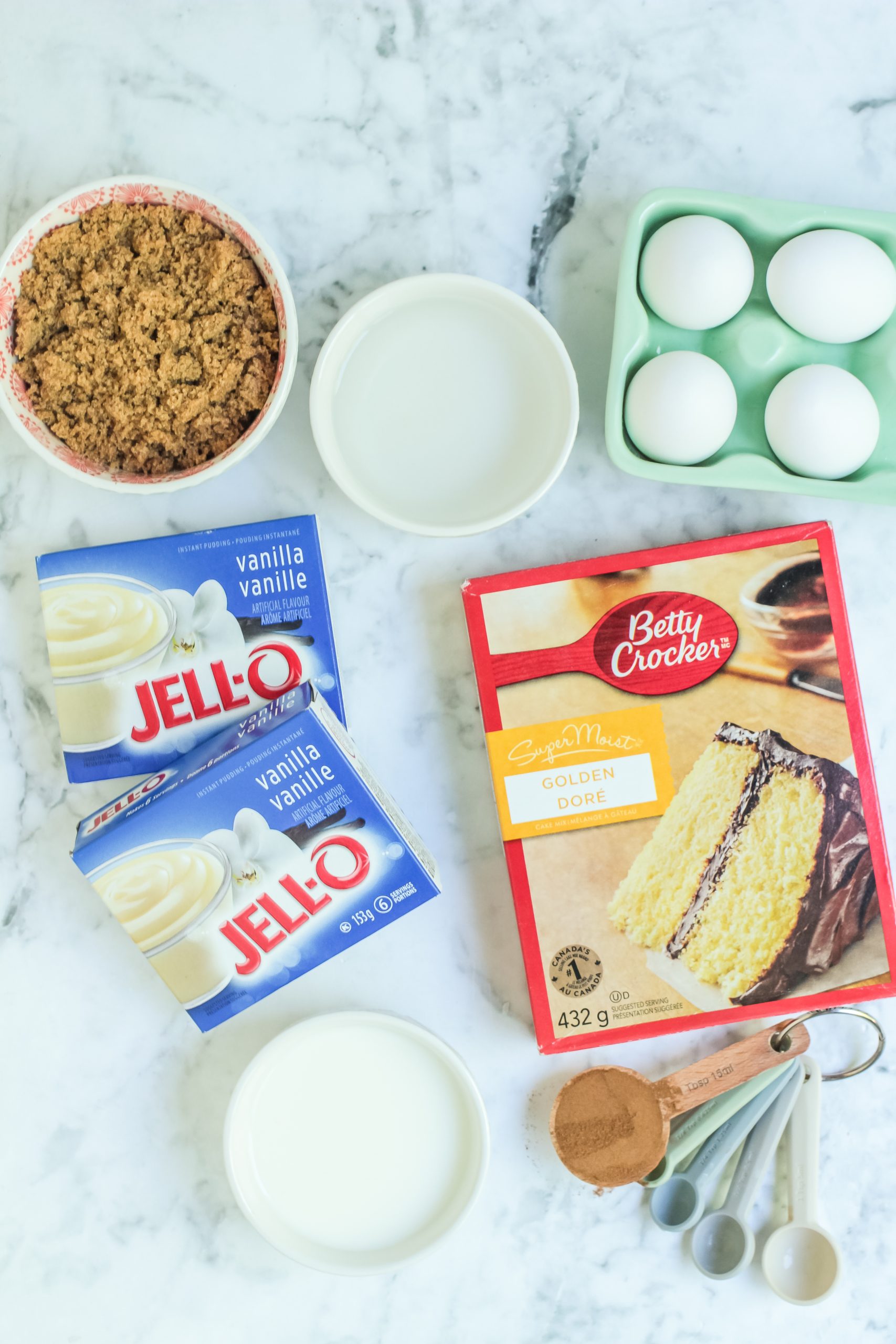 Box of cake mix and jello pudding with other coffee cake mix ingredients. 