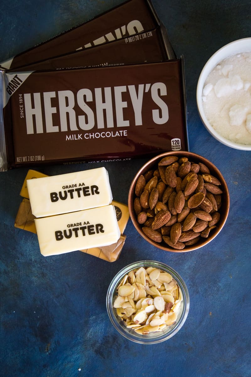 Ingredients to make English butter toffee on blue background