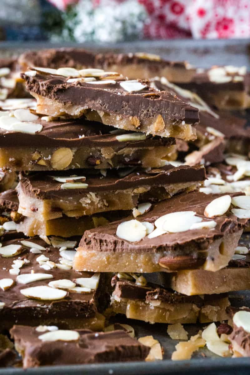 Up close photo of the stacked squares of chocolate topped English butter toffee. 