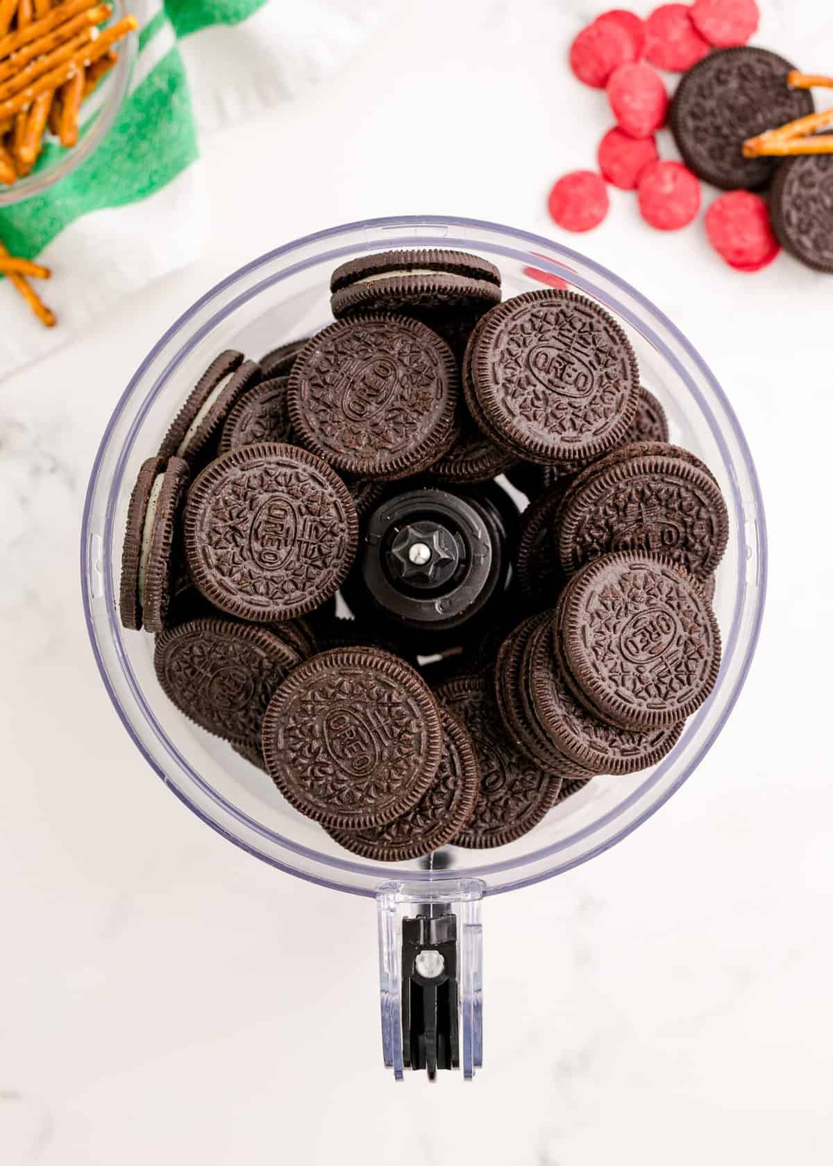 Overhead shot of food processor filled with whole Oreos. 