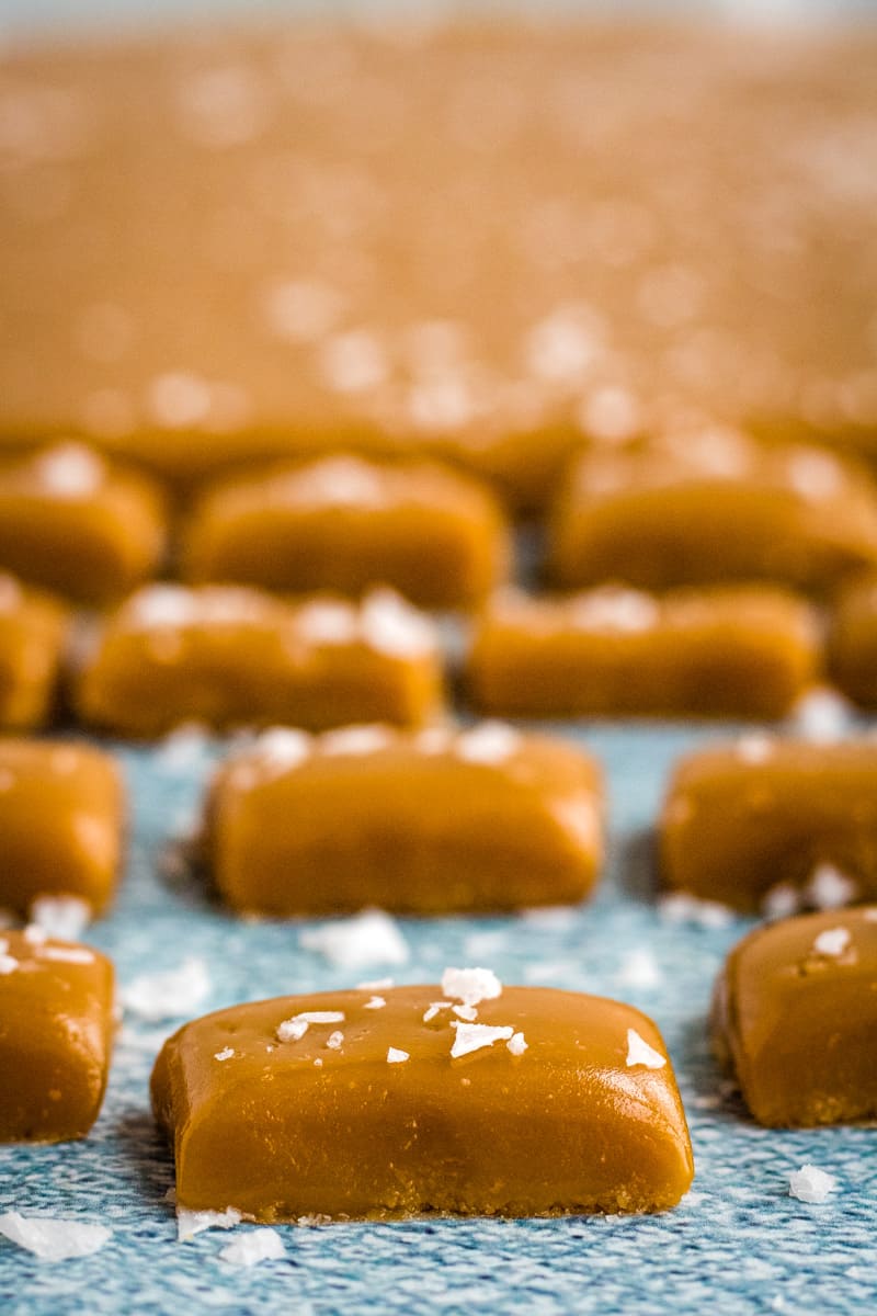 Up close photo of the individually cut caramels before wrapping. 