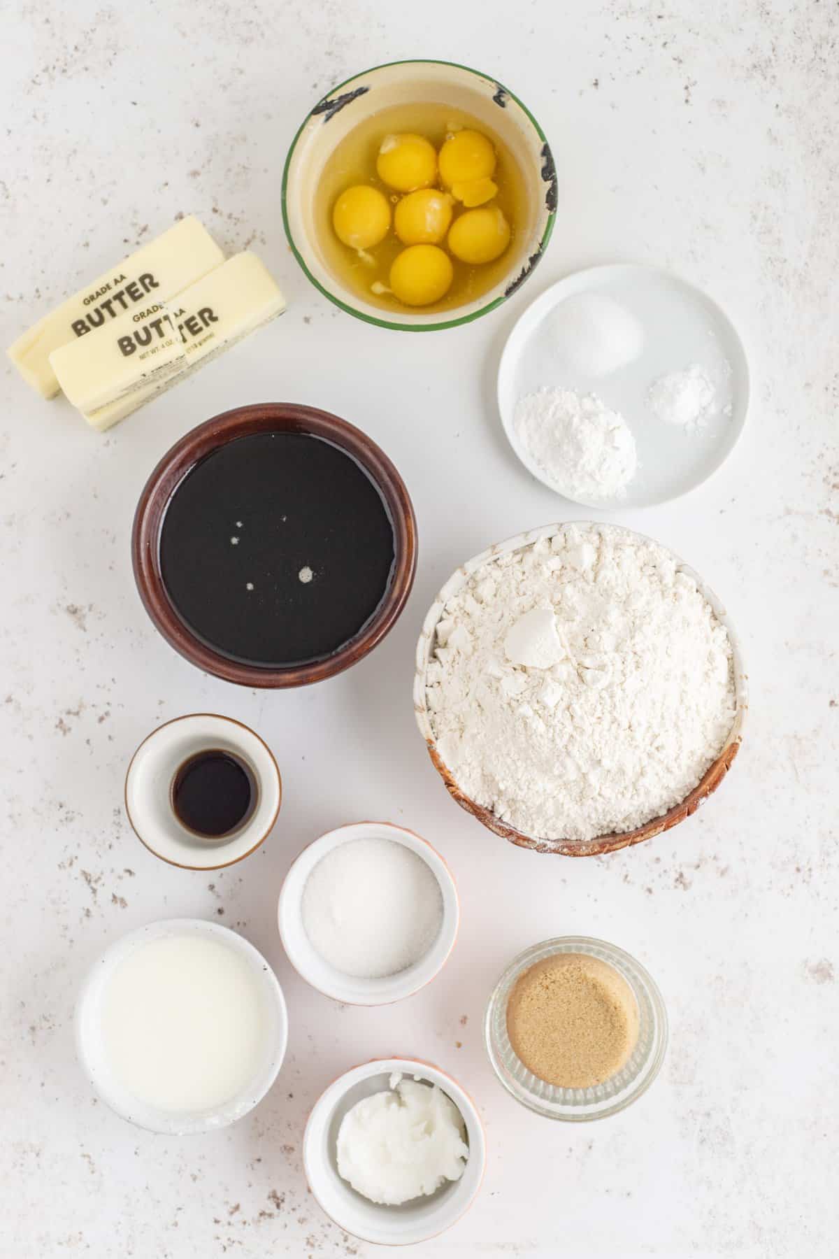 Ingredients to make the maple cake in small glass bowls. 