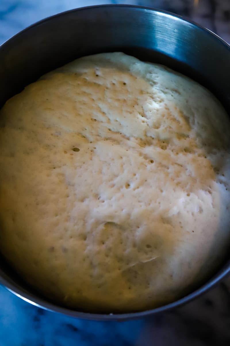 Dough that has doubled in size in large metal bowl. 