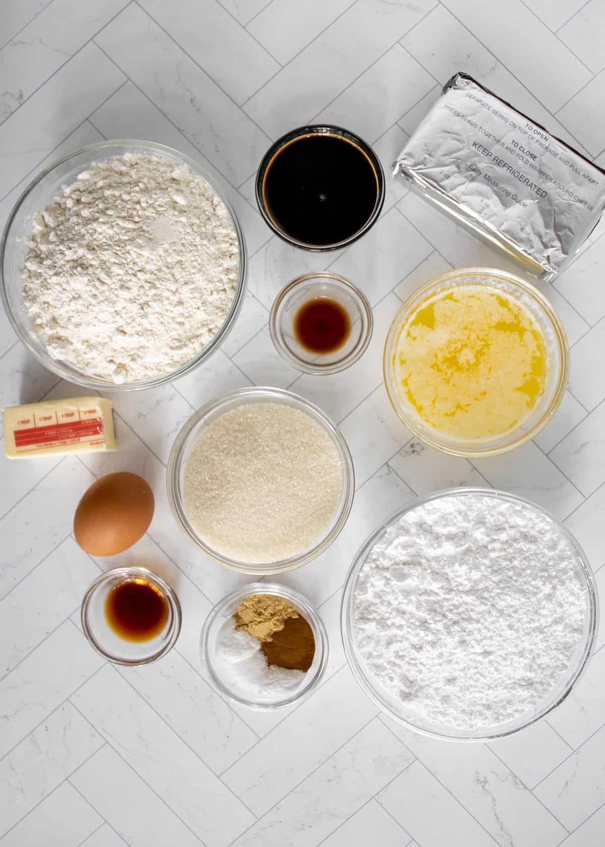 Ingredients to make the gingerbread whoopee pie sandwiches on a marble background. 