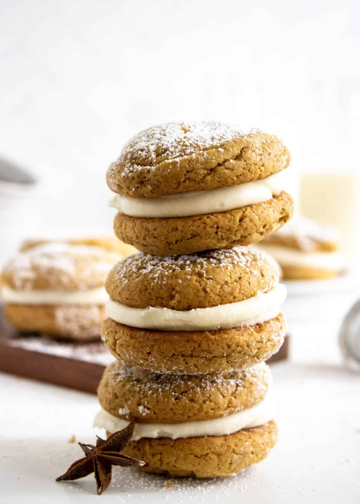 Three whoopie pies stacked together with white background.