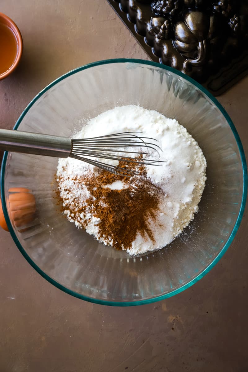 Combining the dry ingredients in a large glass bowl with whisk. 