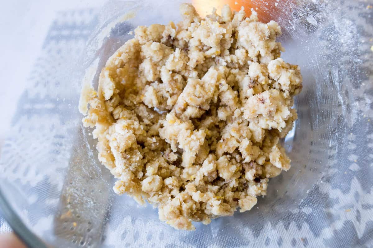 Glass bowl with the brown sugar streusel topping ready for muffins.