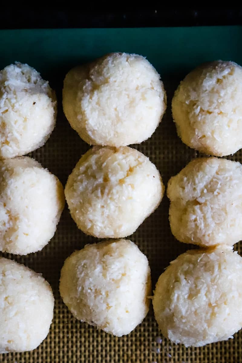 Up close photo of the balls rolled and on a cookie sheet. 