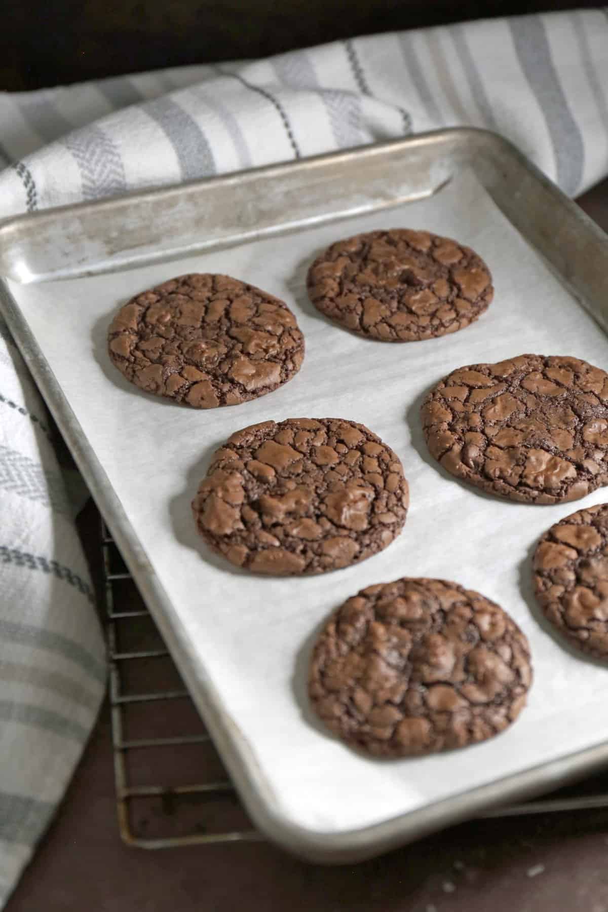 The baked cookies on a parchment lined cookie sheet. 