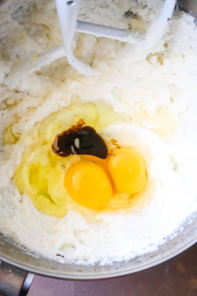 Up close shot of the creamed butter and sugar with eggs and vanilla. 