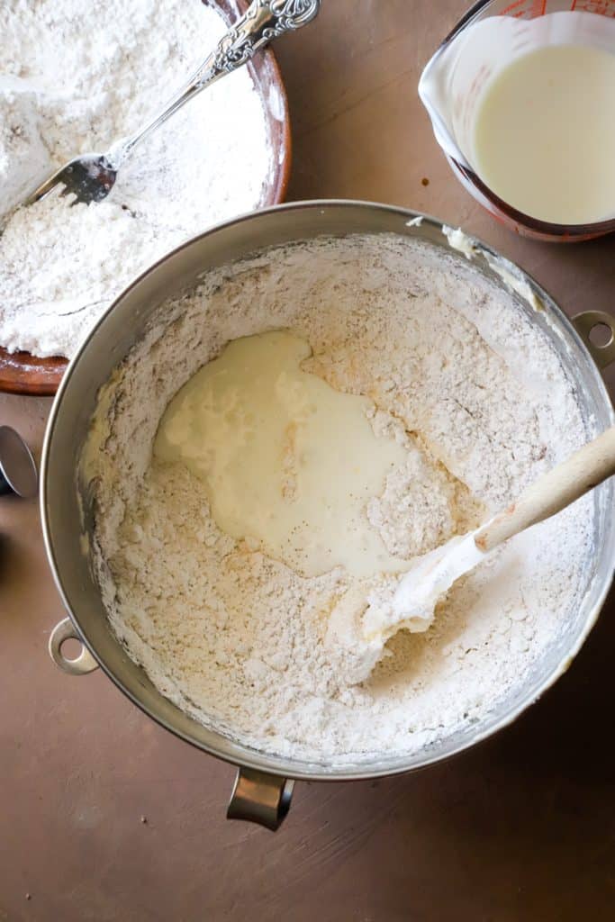 Overhead shot  of adding the buttermilk and flour mixture to the batter. 