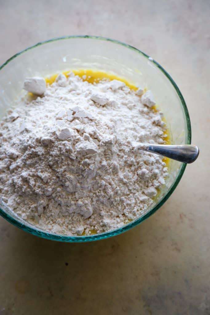 Adding the sugar and pancake mix to the banana batter. 