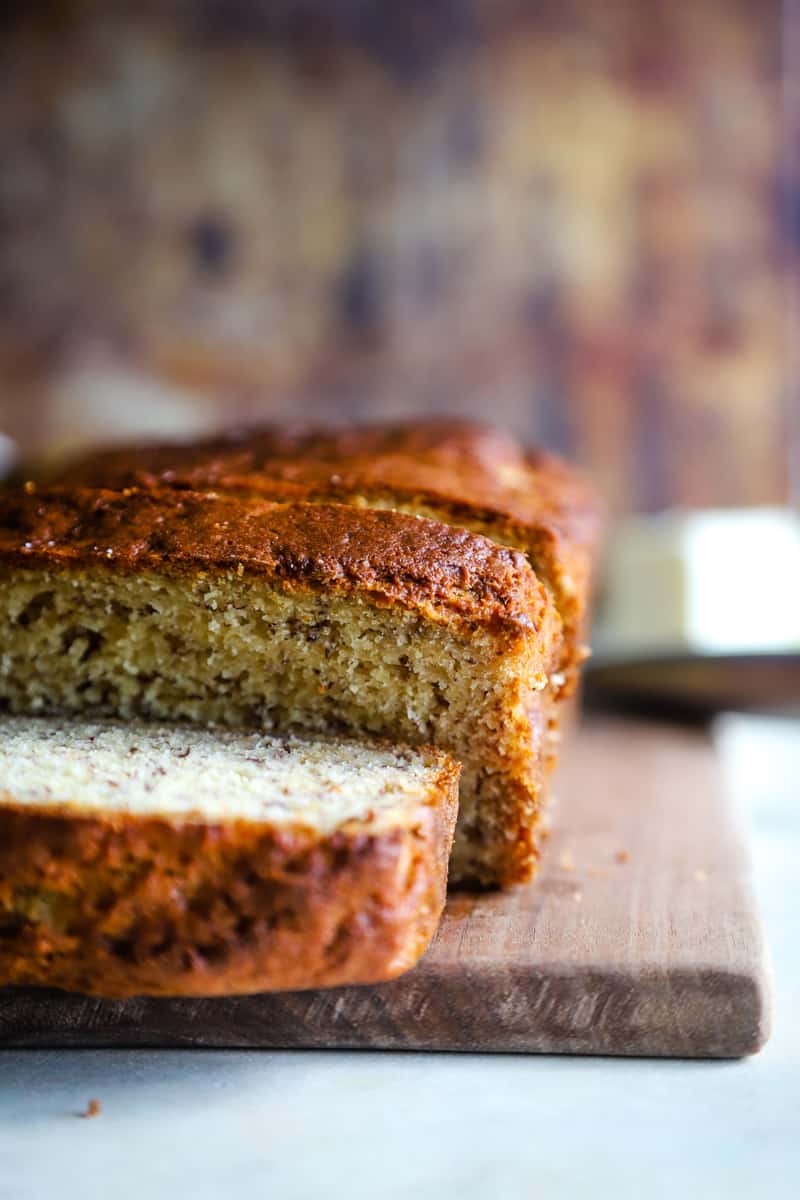 Up close shot of the loaf of bread with end sliced off. 