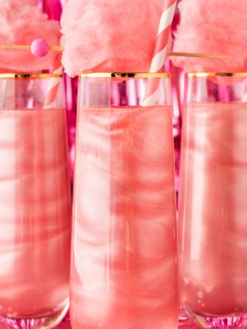 Square feature image of the three pink cocktails with cotton candy tops