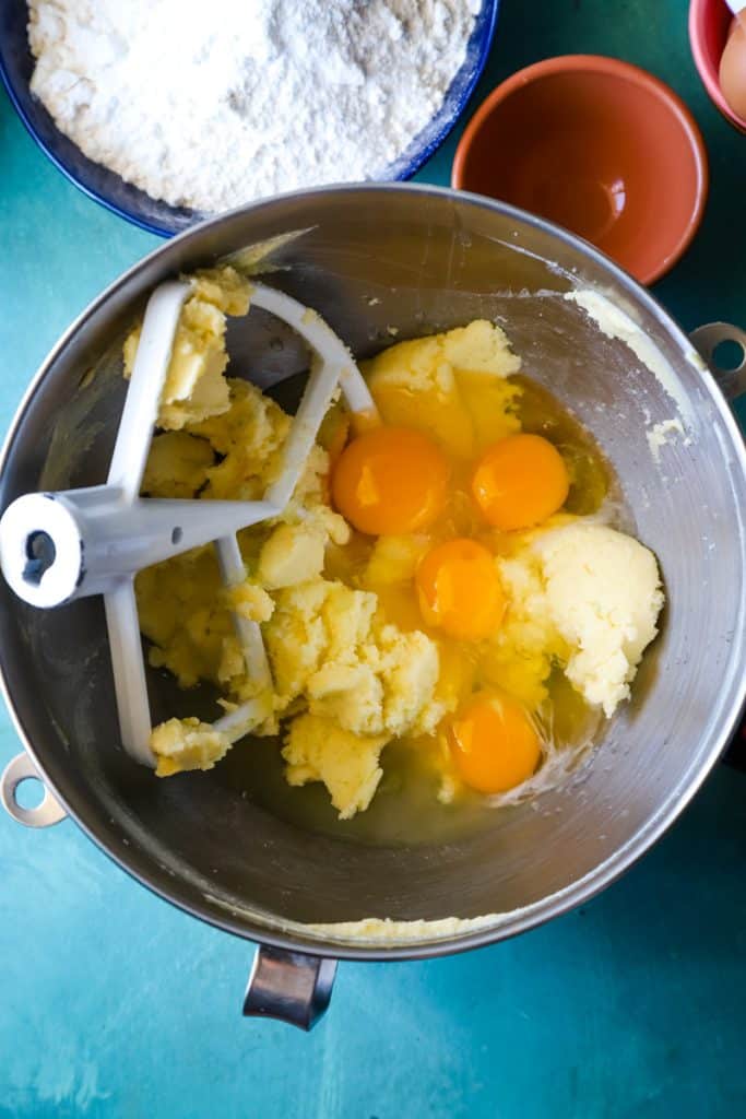 Adding the eggs to the butter/sugar mixture in large metal mixing bowl. 