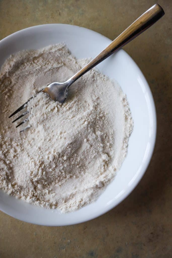 Fork whisking together the flour and sugar for streusel mix. 