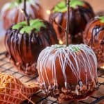 Square image of the gourmet caramel apples with toffee bits and chocolate drizzle.